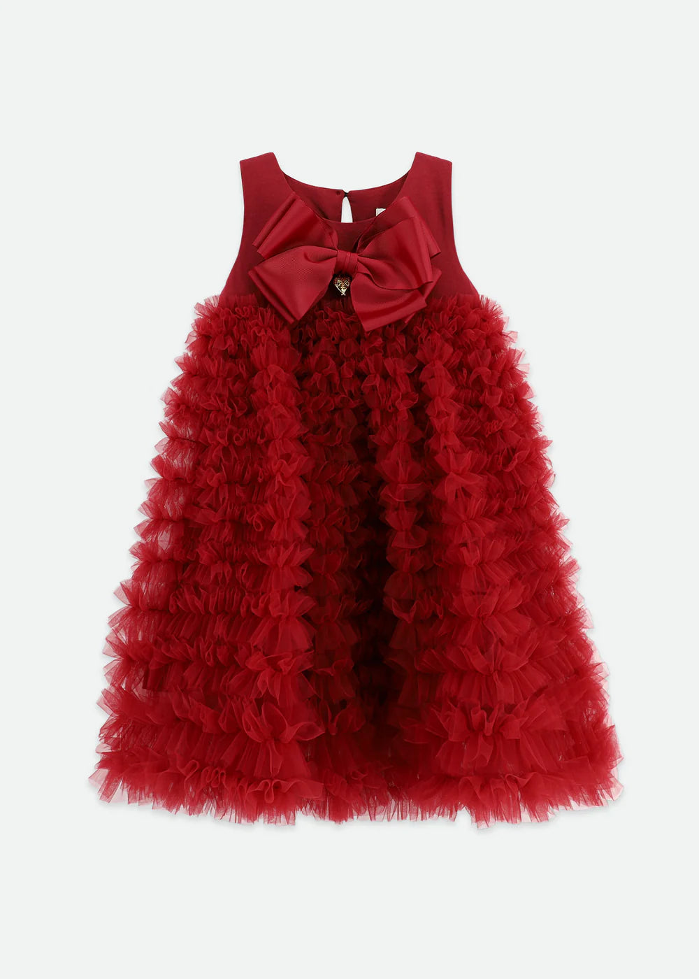 Tibetan red dress made with multiple layers of tulle lace, featuring an Angel's Face signature bow, gold heart charm on the cotton bodice, and a voluminous ruffle skirt. Fastens with a gold logo button at the back