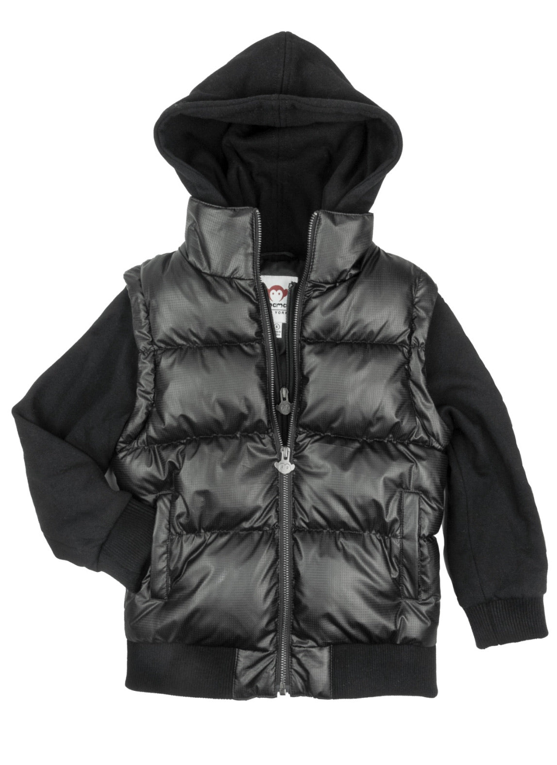 Young boy wearing the Turnstile Jacket in Black Steel, featuring a removable sleeve, front pockets, and a hood. Stylish and functional outerwear designed for playful adventures and changing weather.