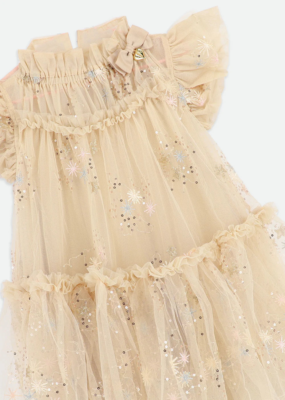 Girls' gorgeous gold glitter star dress with voluminous soft tulle, fully lined in cotton. Features signature bow, gold heart charm on the neckline, and a gold logo button fastening at the back.