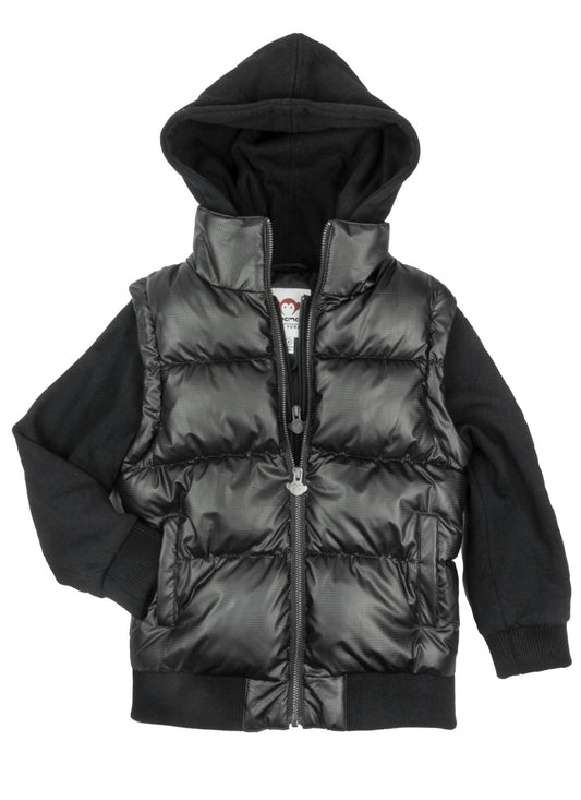 Young boy wearing the Turnstile Jacket in Black Steel, featuring a removable sleeve, front pockets, and a hood. Stylish and functional outerwear designed for playful adventures and changing weather.